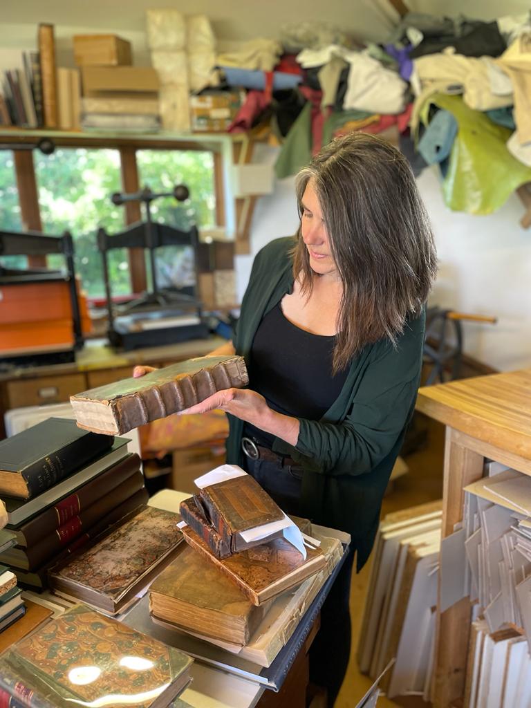 Assessing a new consignment of books for restoration