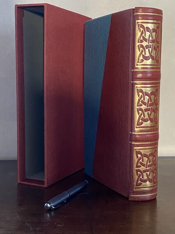 Large, Chunky plain paged book bound in terracotta and pale blue leather