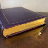 Purple leather bound journal with decorative gold tooling